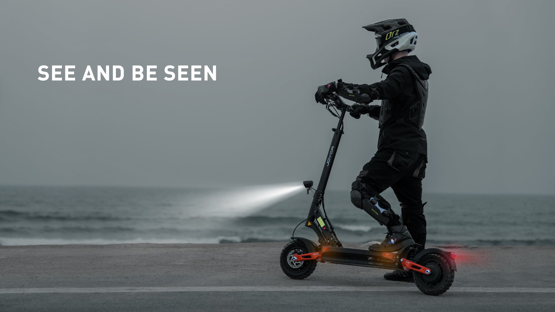 Rider using the Buffseek T10 electric scooter at night with the lighting system activated